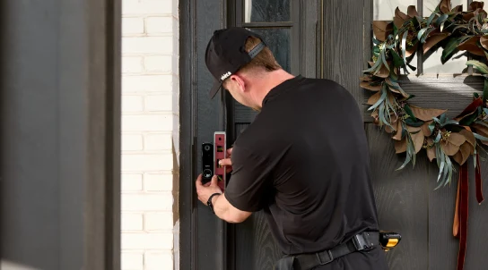 Vivint tech professionally installing the Vivint doorbell