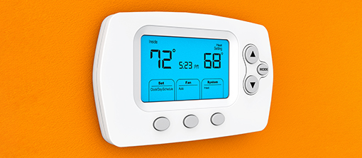 Modern Programming Thermostat on a orange wall; Shutterstock ID 244295878; Purchase Order: -