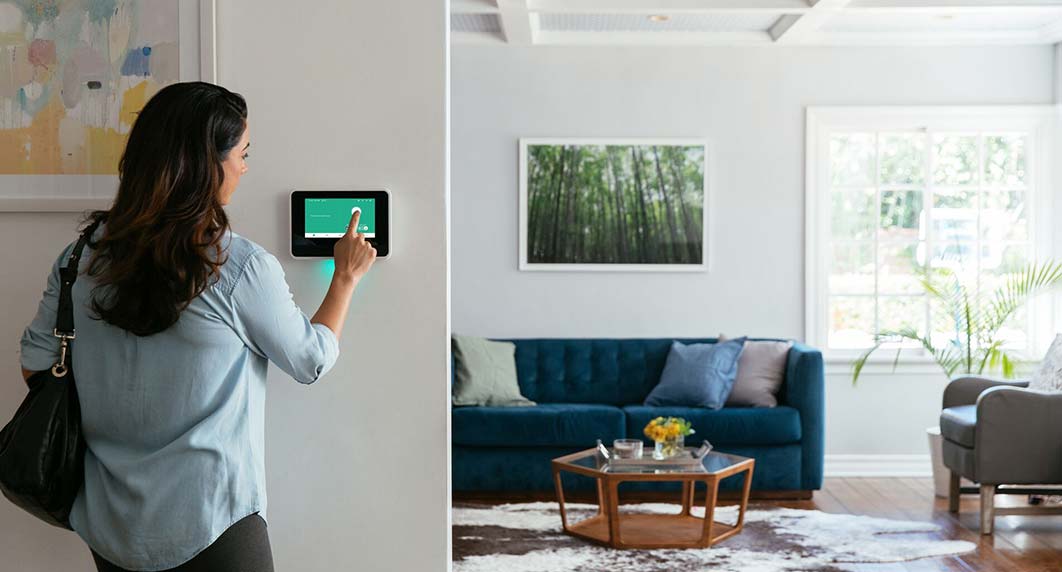 Person using the Vivint home security hub