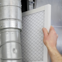 Person changing an air filter
