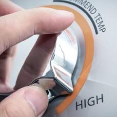 Person setting water heater temperature