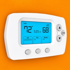 Smart thermostat on orange background