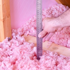 Person checking insulation level